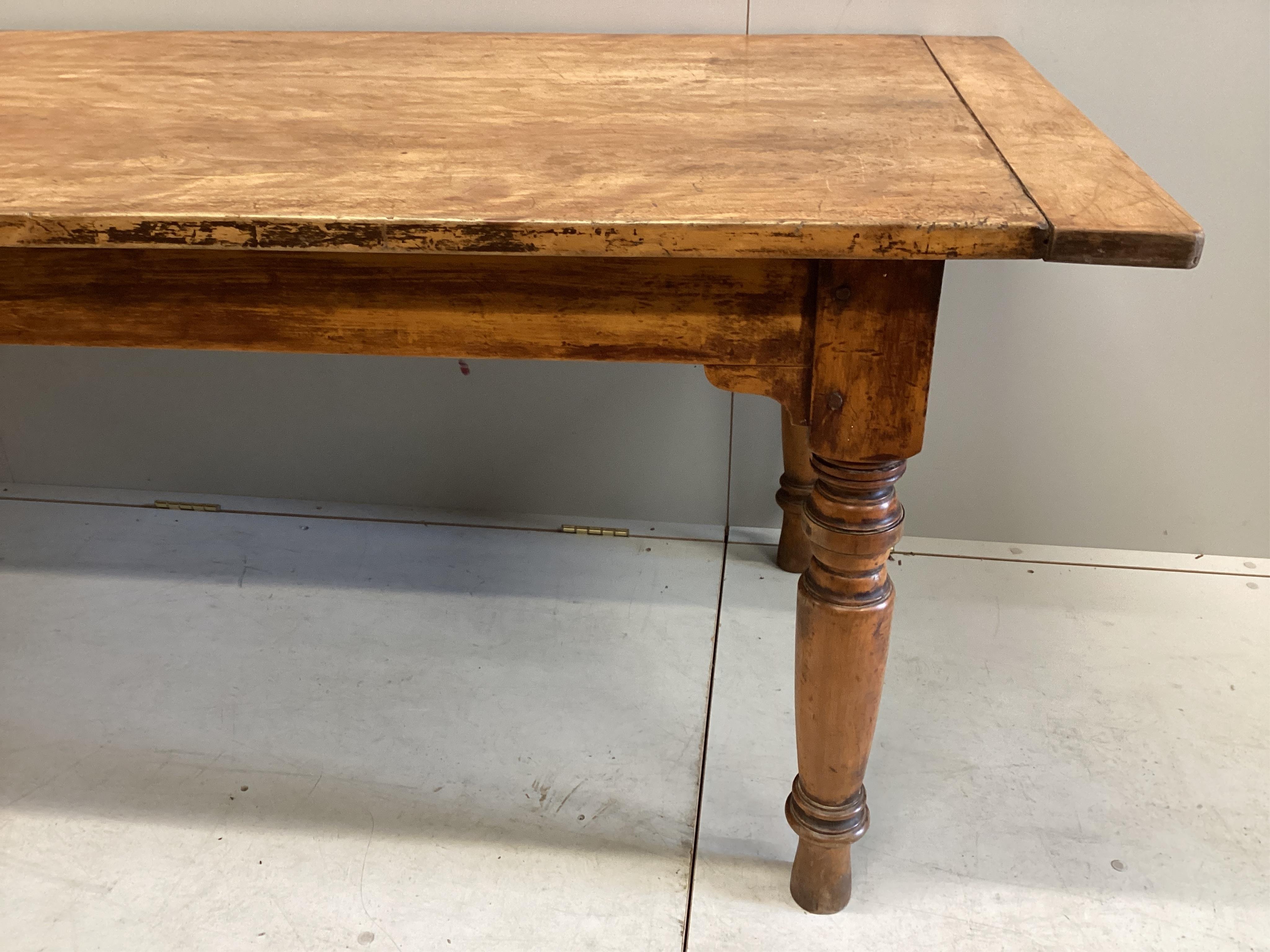 A 19th century rectangular birch kitchen table, width 233cm, depth 80cm, height 73cm. Condition - fair